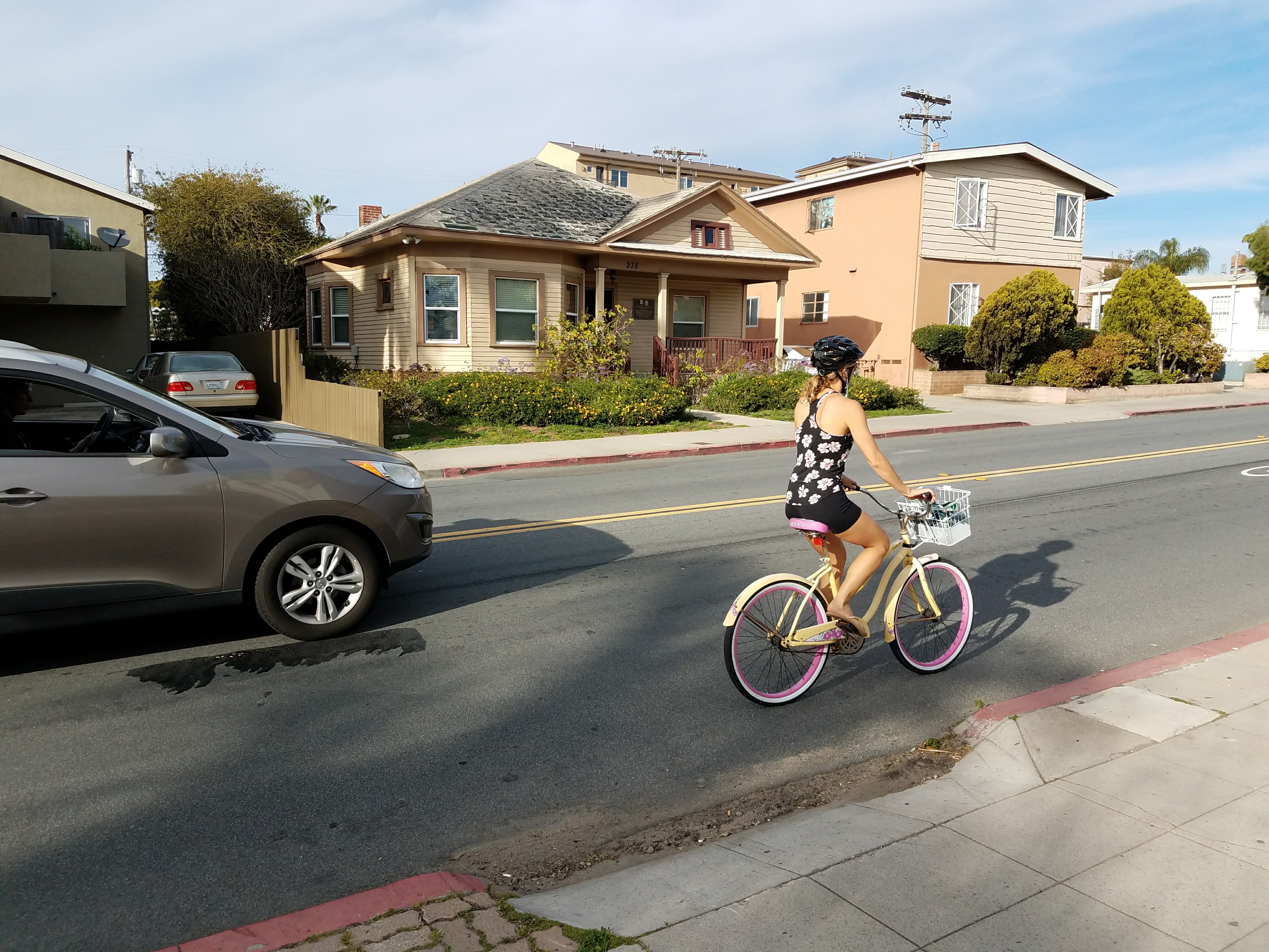 Female riding a bike on University Avenue near Dove Street